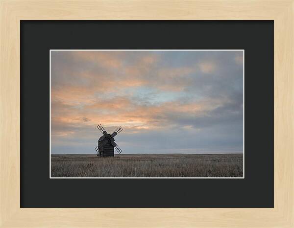 Windmill Silhouetted Against Orange Sky