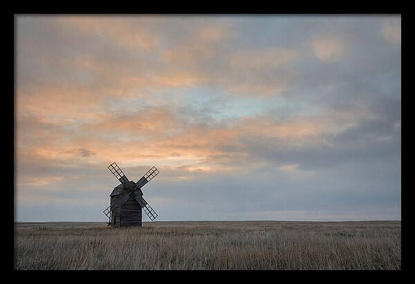 Windmill Silhouetted Against Orange Sky