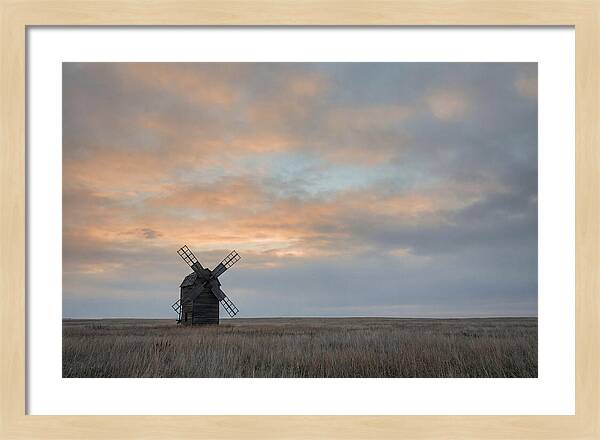 Windmill Silhouetted Against Orange Sky