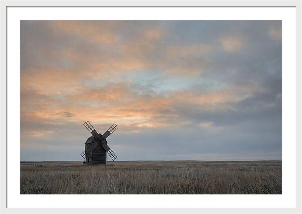 Windmill Silhouetted Against Orange Sky