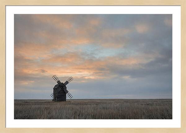 Windmill Silhouetted Against Orange Sky