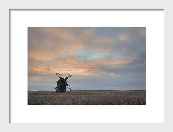 Windmill Silhouetted Against Orange Sky