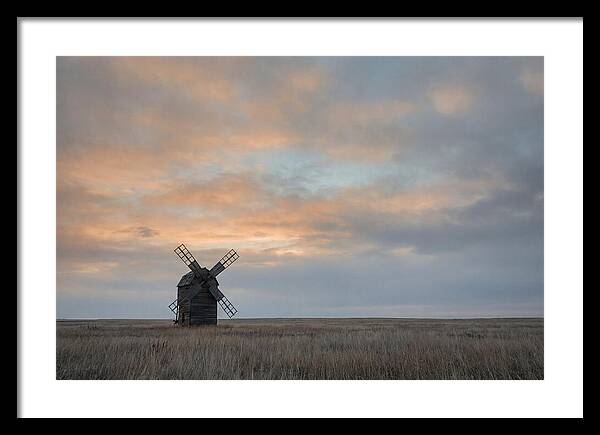 Windmill Silhouetted Against Orange Sky