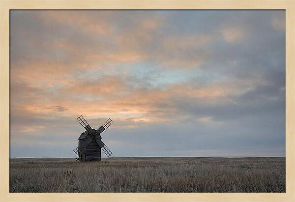 Windmill Silhouetted Against Orange Sky