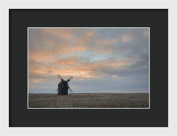 Windmill Silhouetted Against Orange Sky