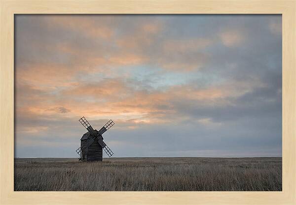 Windmill Silhouetted Against Orange Sky