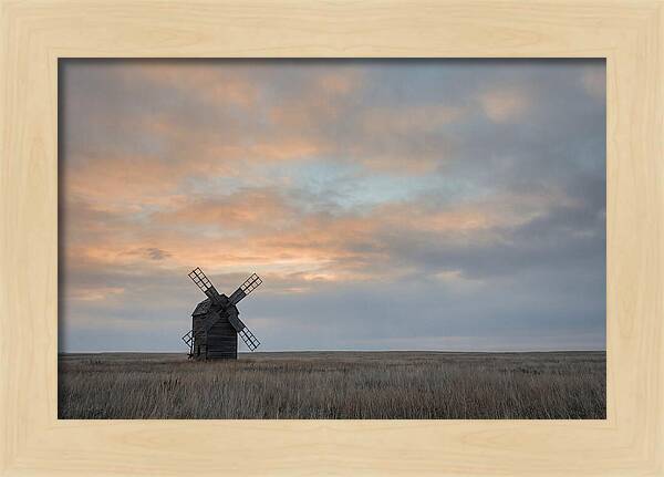 Windmill Silhouetted Against Orange Sky