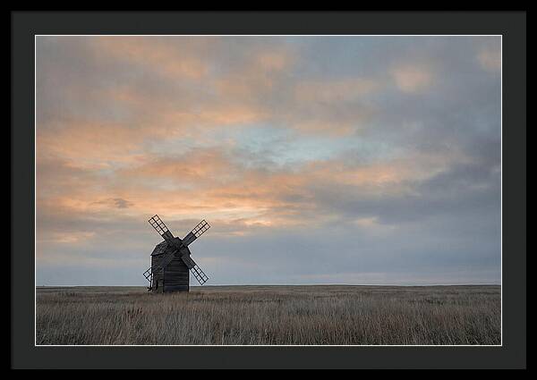 Windmill Silhouetted Against Orange Sky