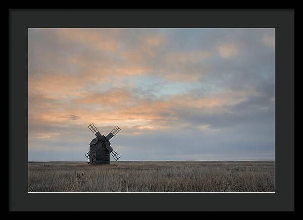 Windmill Silhouetted Against Orange Sky