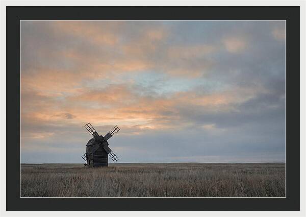 Windmill Silhouetted Against Orange Sky
