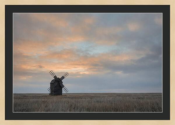 Windmill Silhouetted Against Orange Sky