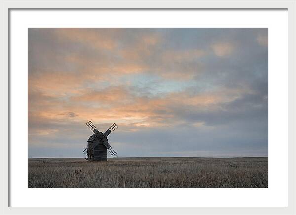 Windmill Silhouetted Against Orange Sky