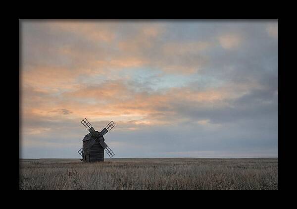 Windmill Silhouetted Against Orange Sky
