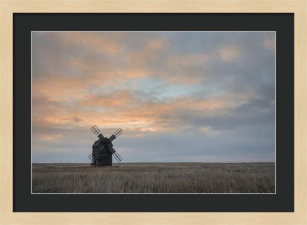 Windmill Silhouetted Against Orange Sky