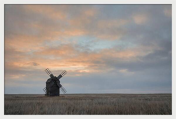Windmill Silhouetted Against Orange Sky