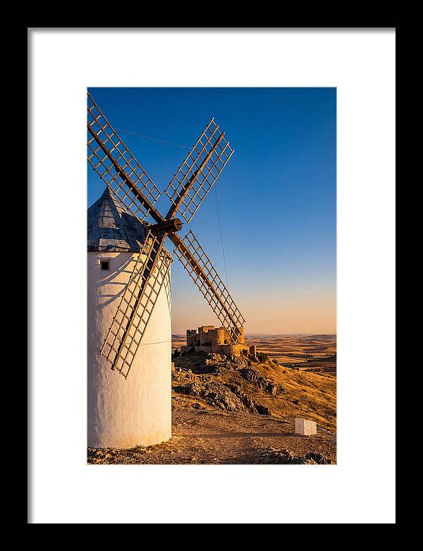 Windmills Against Golden Horizon