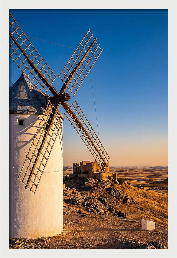 Windmills Against Golden Horizon