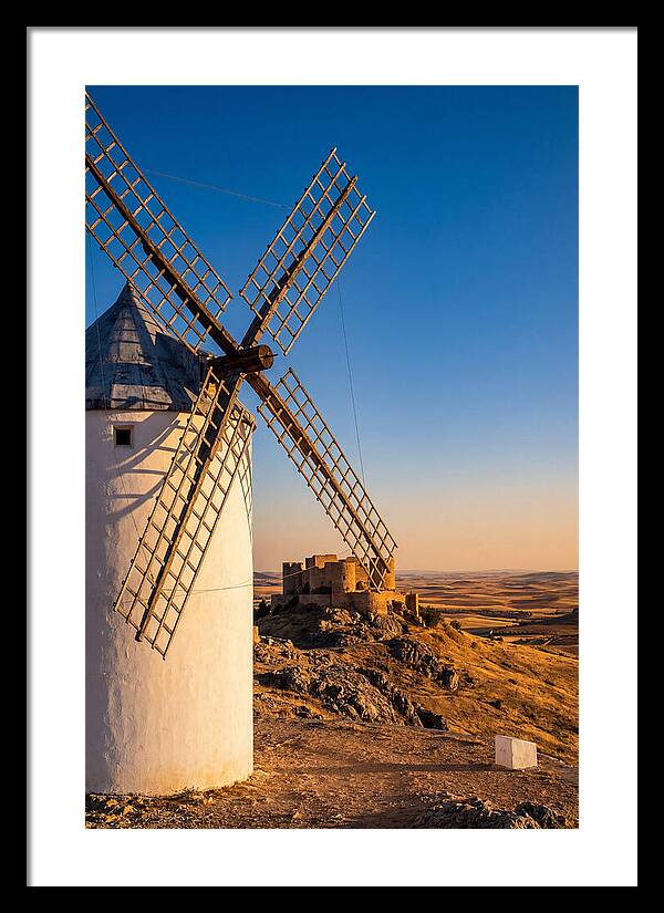 Windmills Against Golden Horizon