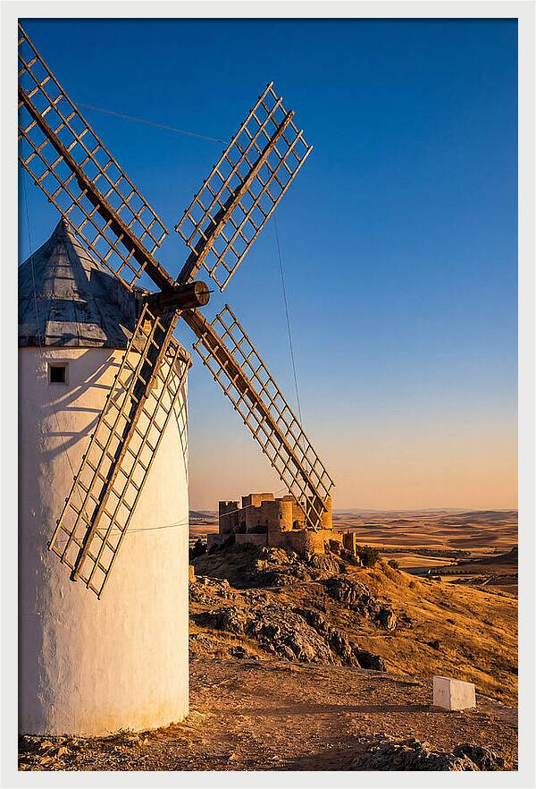 Windmills Against Golden Horizon
