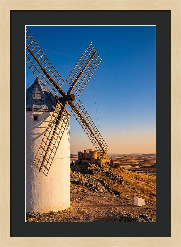 Windmills Against Golden Horizon