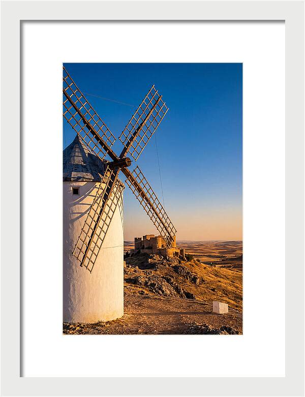 Windmills Against Golden Horizon