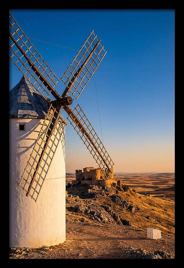 Windmills Against Golden Horizon