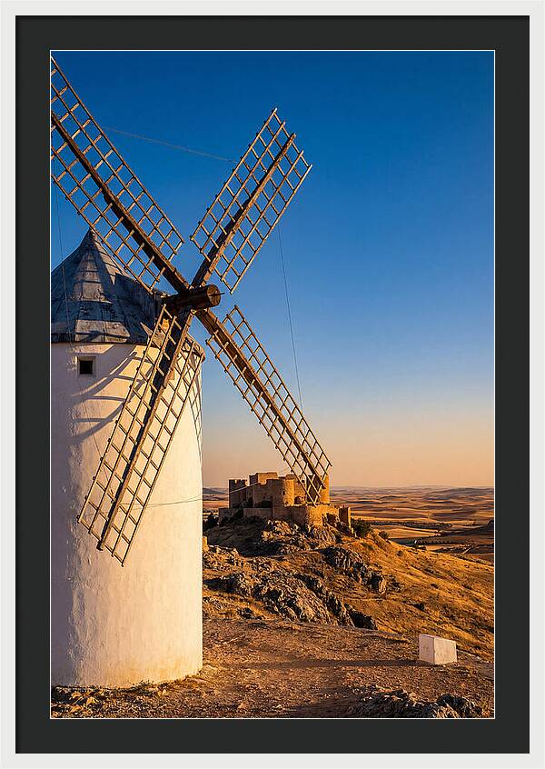 Windmills Against Golden Horizon