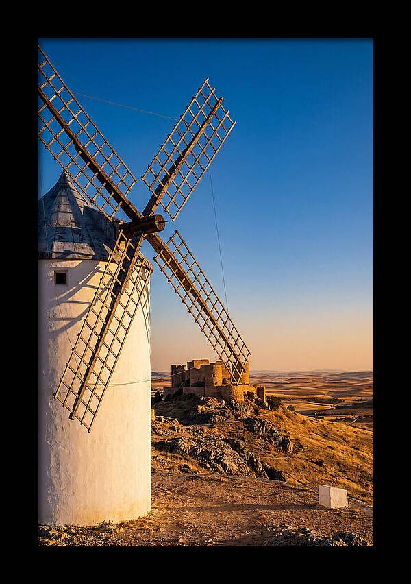 Windmills Against Golden Horizon