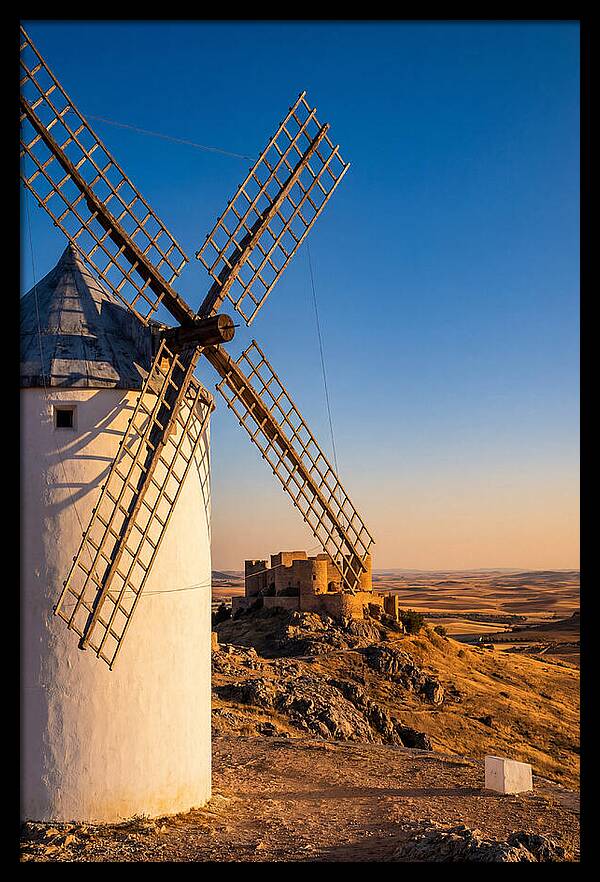 Windmills Against Golden Horizon