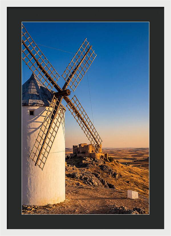 Windmills Against Golden Horizon