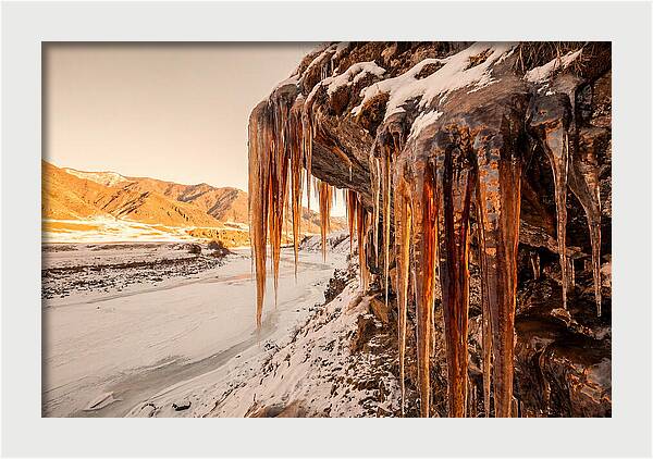 Winter Icicles Hanging From Rock